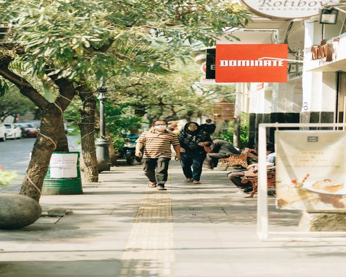 A pair of comfortable casual walking shoes on pavement in Bandung